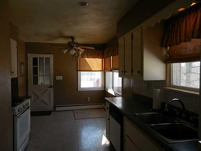 217 Kelley Road Industry, PA 15052 - Photo 5 of 25 Kitchen. Stylish and cute! Eat in kitchen with exit to breezeway. Light, bright, fresh with new paint and clean lines.