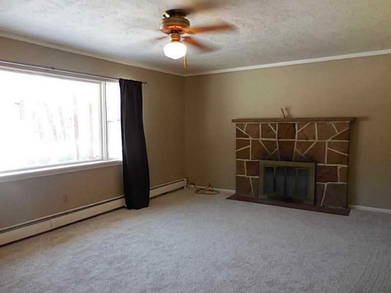 217 Kelley Road Industry, PA 15052 - Photo 7 of 25 Living Room. Nice spacious living room. with fireplace and picture window to wonderful back yard.
