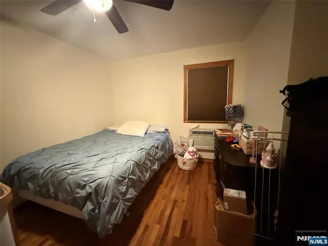 a bedroom with a bed and a mirror