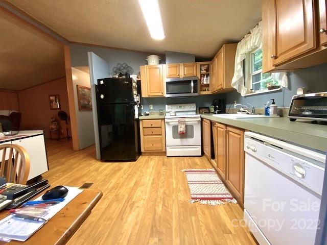 759 Winchester Road Bryson City, NC 28713 - Photo 8 of 17 a kitchen with stainless steel appliances granite countertop a refrigerator and a stove top oven