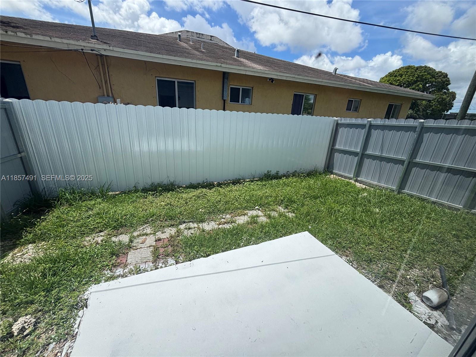 26514 Southwest 138th Avenue, Unit 26514 Homestead, FL 33032 - Photo 14 of 14 a view of a backyard