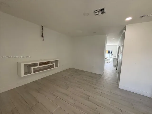 a view of a livingroom with wooden floor