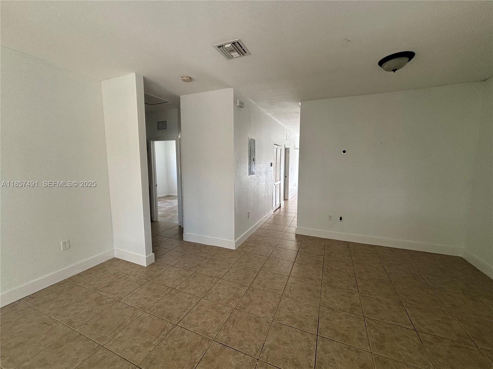 26514 Southwest 138th Avenue, Unit 26514 Homestead, FL 33032 - Photo 9 of 14 a view of an empty room