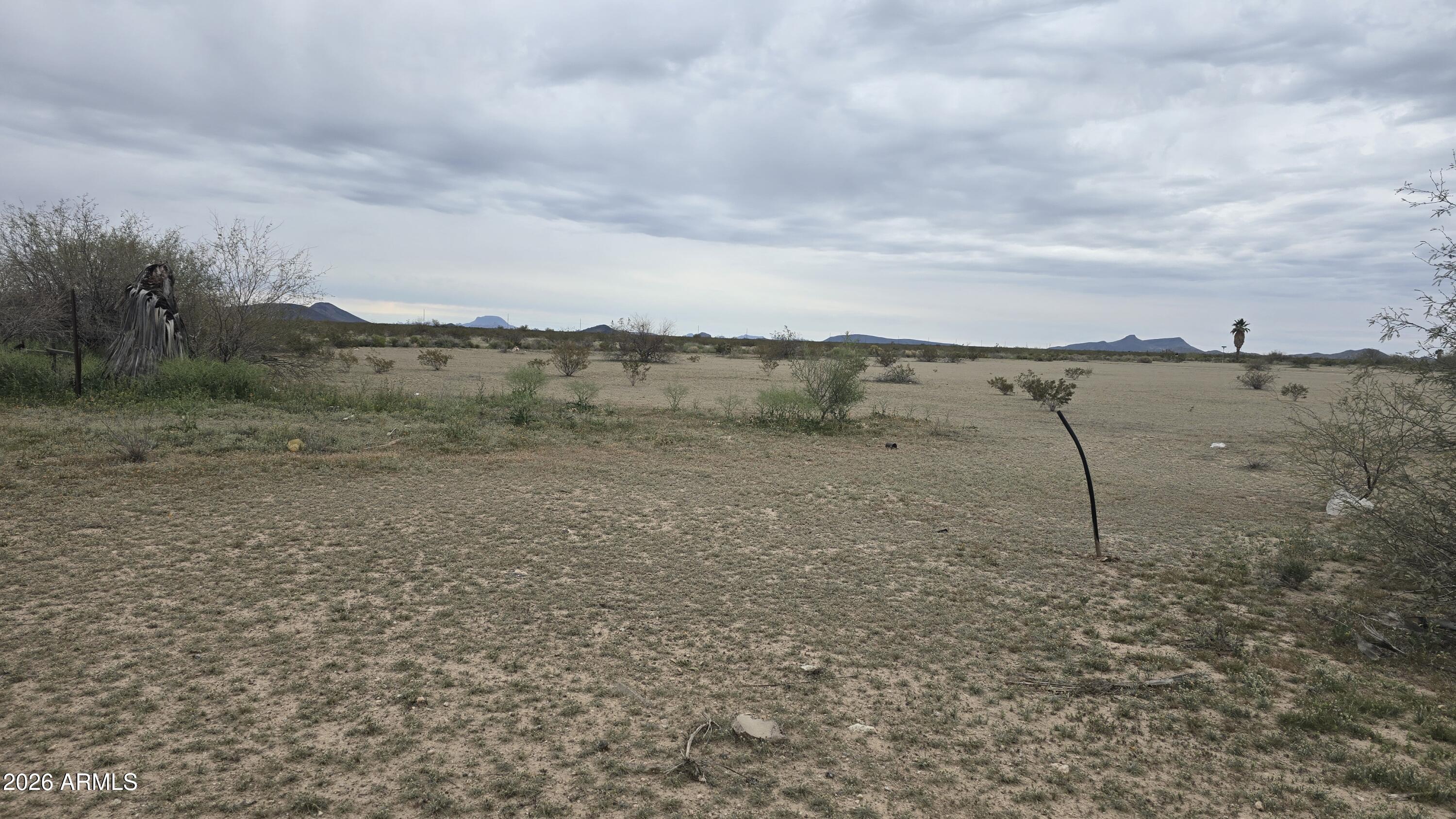 539-aa West Eagletail Road Tonopah, AZ 85354 - Photo 14 of 32 a view of a dry yard with wooden fence