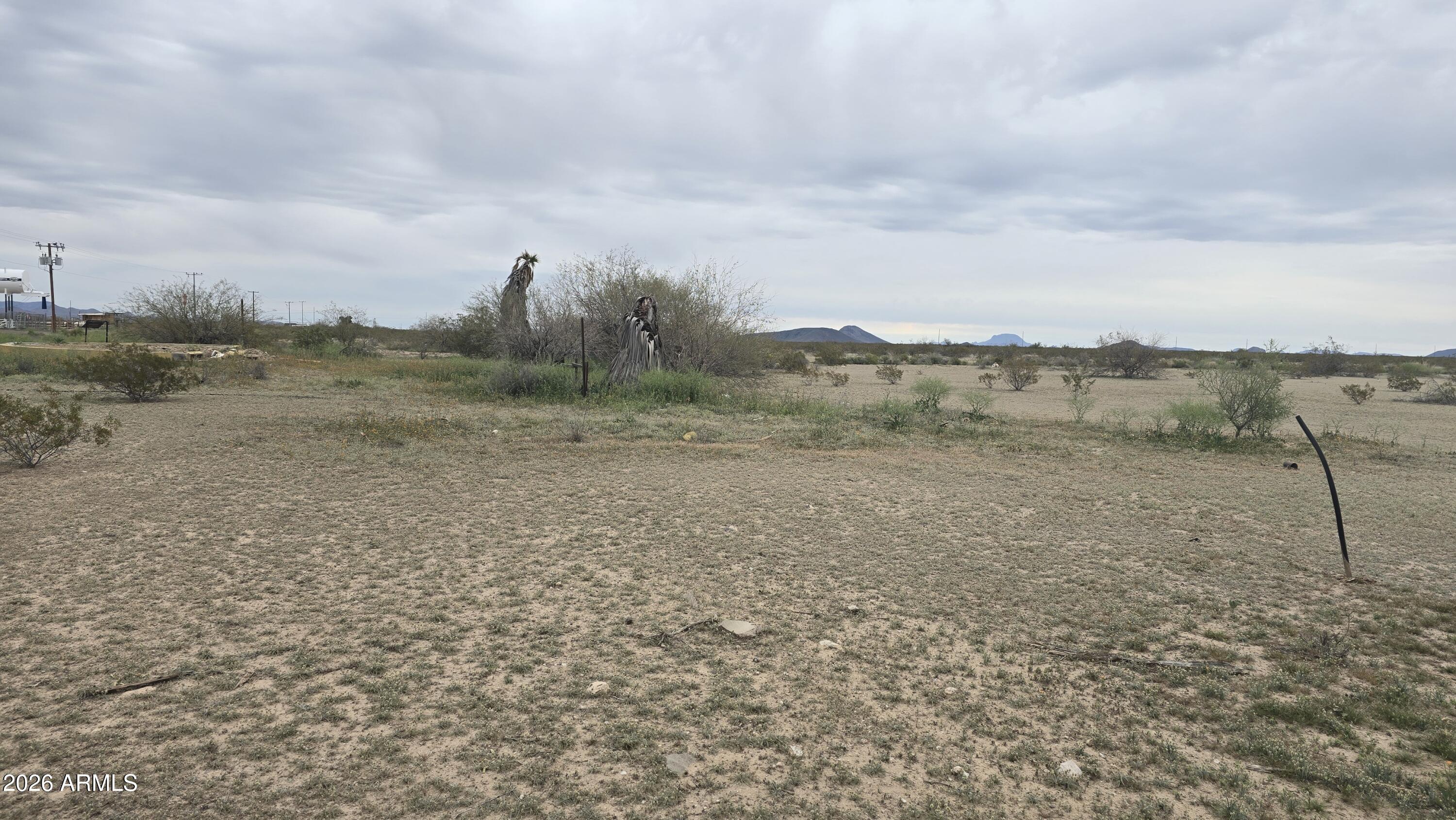 539-aa West Eagletail Road Tonopah, AZ 85354 - Photo 15 of 32 a view of a dry yard with wooden fence