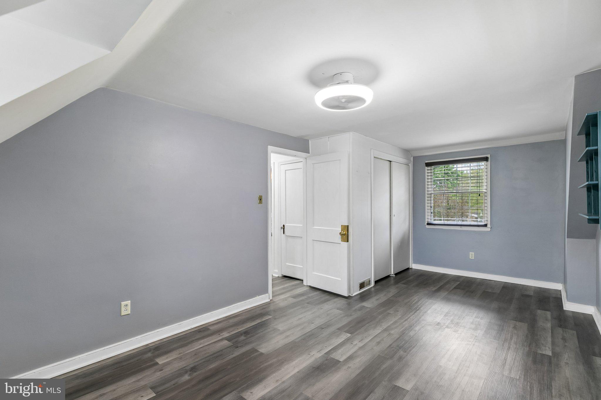 556 Anne Street Huntingdon Valley, PA 19006 - Photo 11 of 50 an empty room with wooden floor and windows