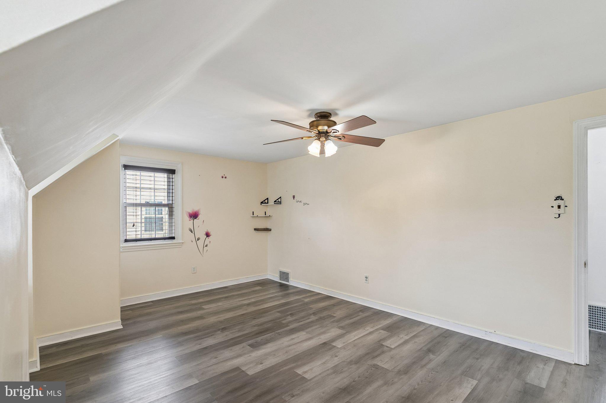 556 Anne Street Huntingdon Valley, PA 19006 - Photo 14 of 50 a view of empty room with wooden floor and fan