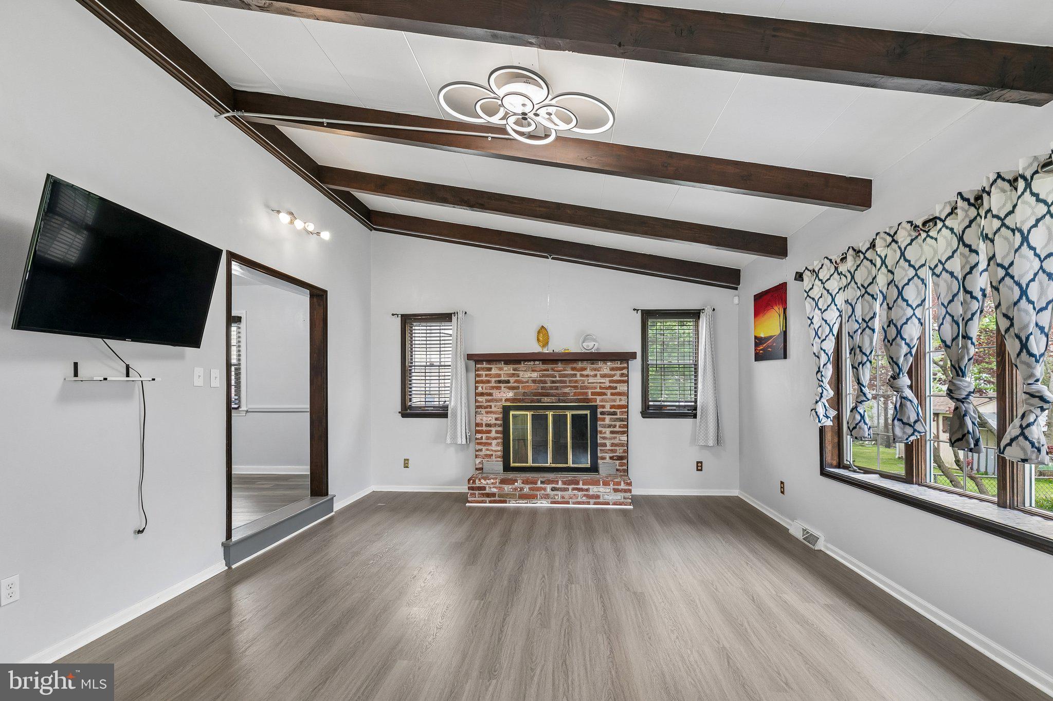 556 Anne Street Huntingdon Valley, PA 19006 - Photo 20 of 50 a view of a livingroom with an empty space and a fireplace