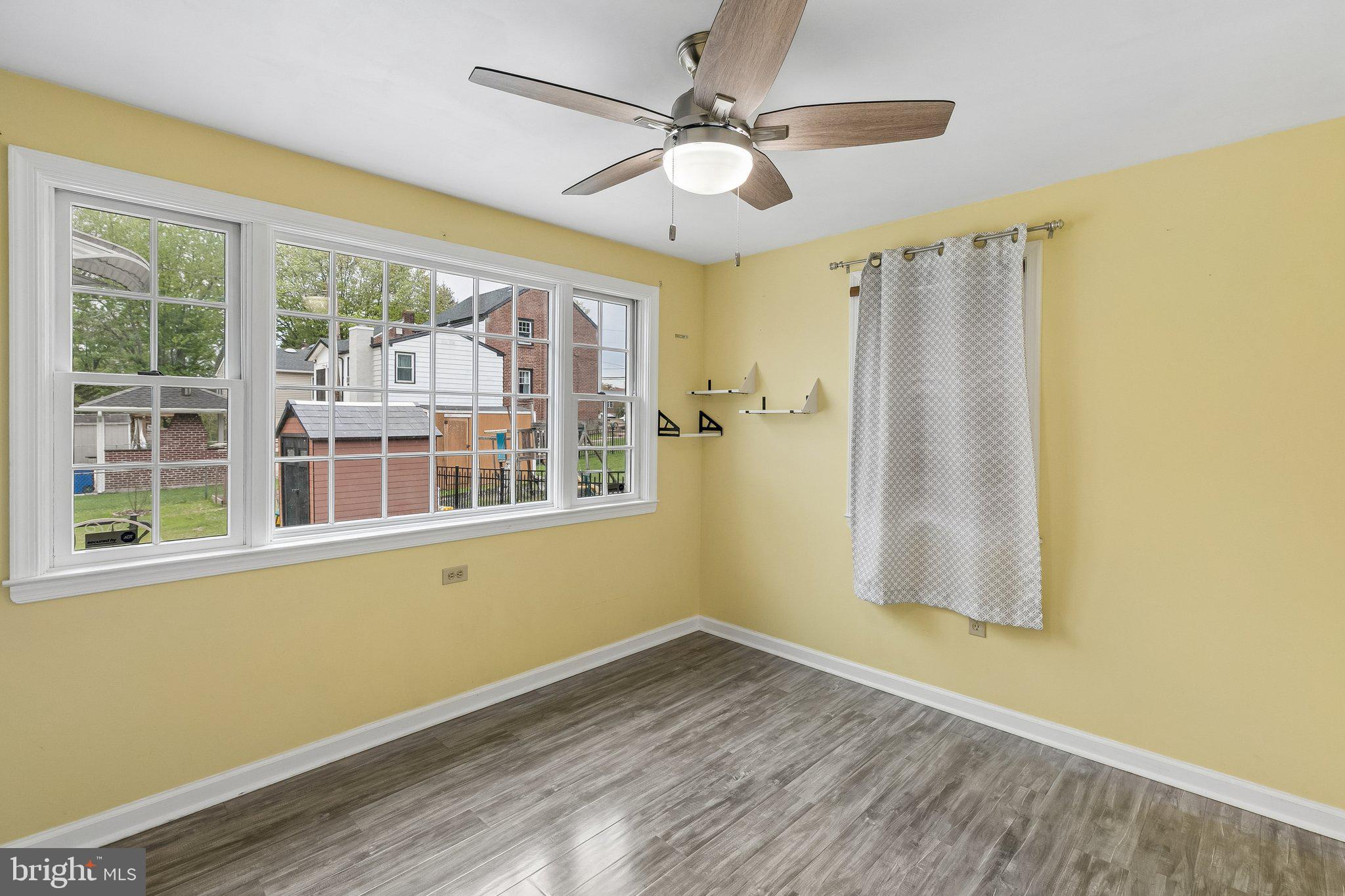 556 Anne Street Huntingdon Valley, PA 19006 - Photo 22 of 50 a view of an empty room with a window and wooden floor