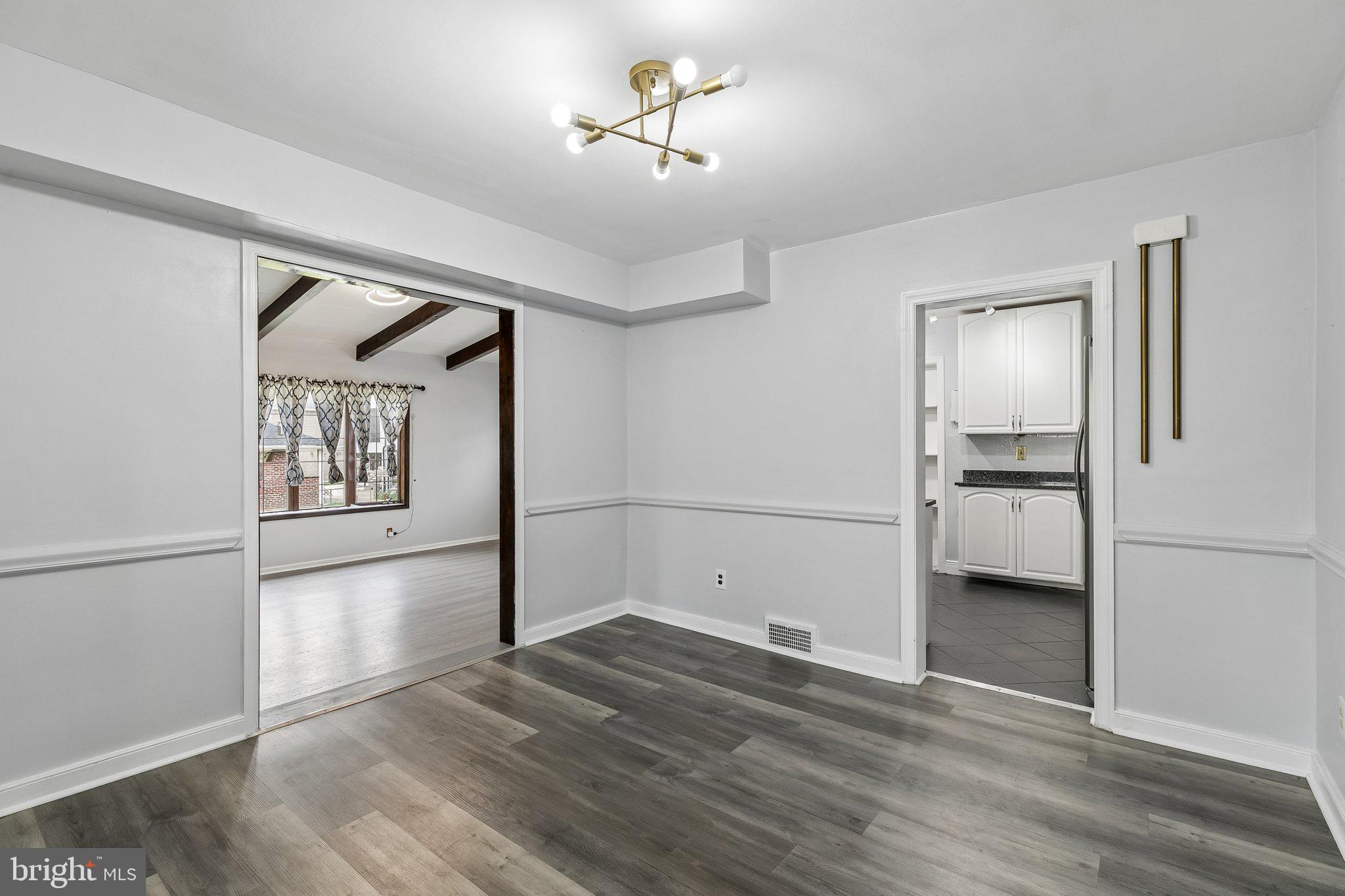 556 Anne Street Huntingdon Valley, PA 19006 - Photo 29 of 50 a view of a hallway with wooden floor and a kitchen