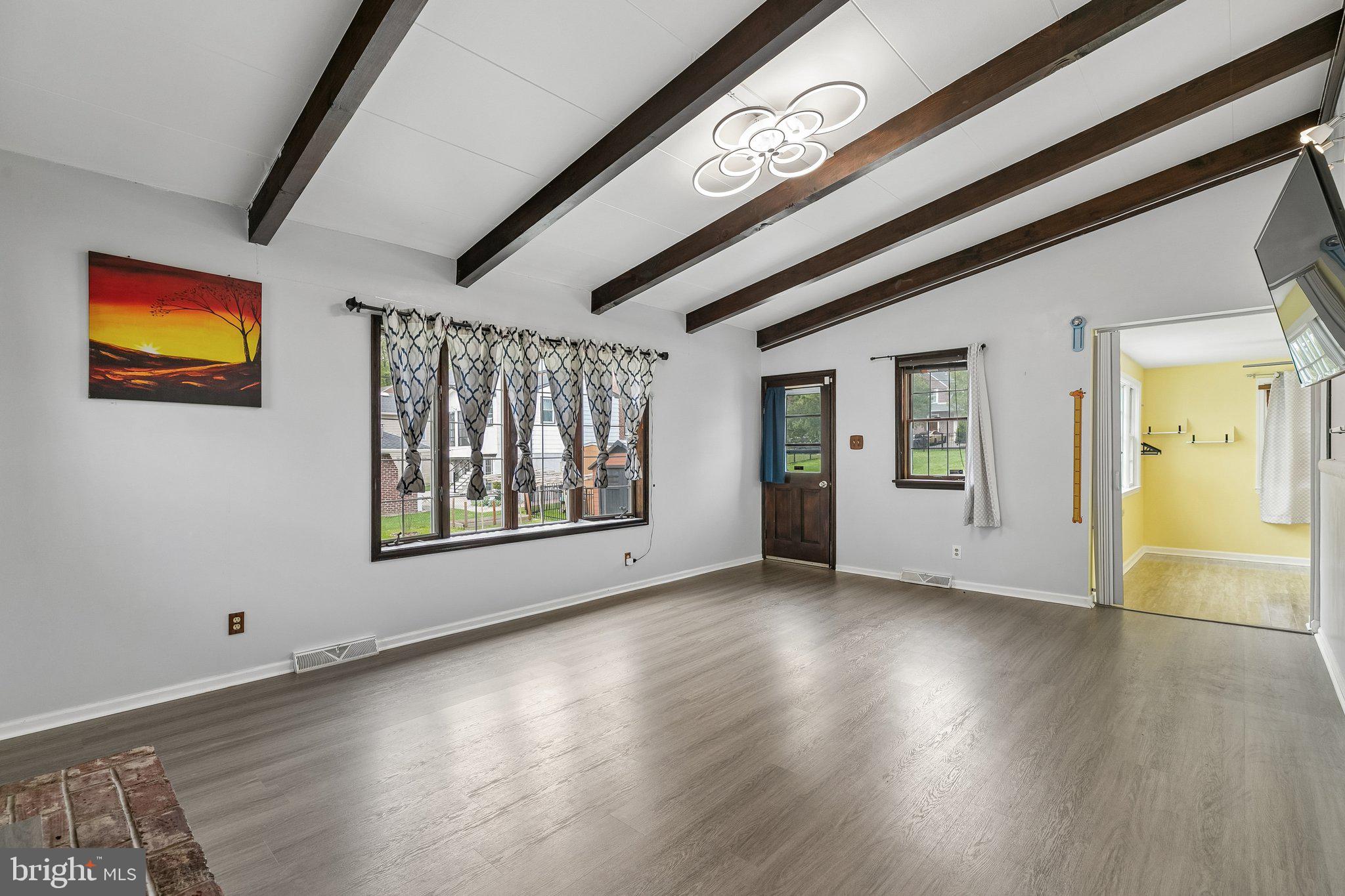 556 Anne Street Huntingdon Valley, PA 19006 - Photo 36 of 50 a view of an empty room with window and wooden floor