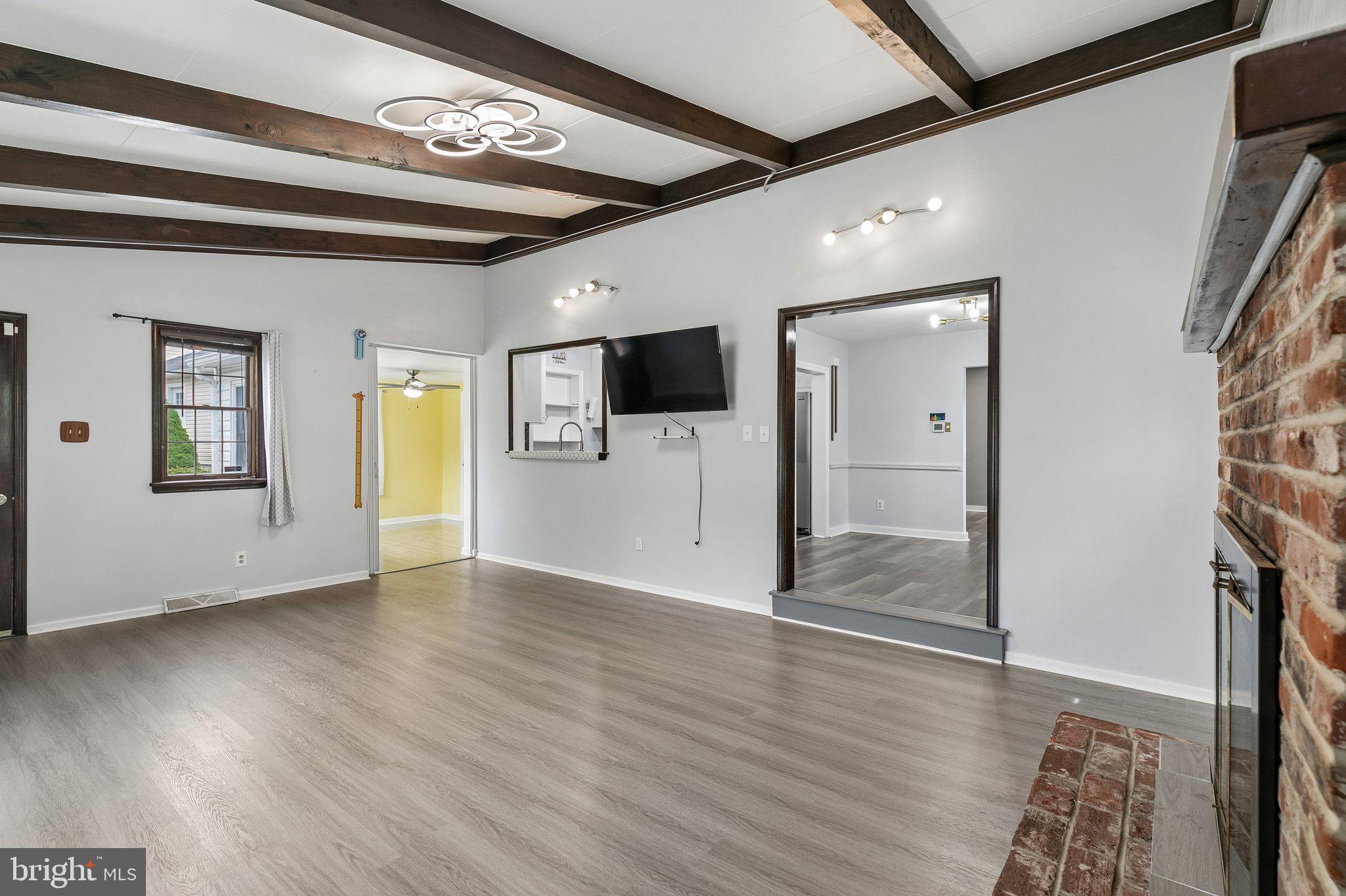 556 Anne Street Huntingdon Valley, PA 19006 - Photo 37 of 50 a view of an empty room with a window and wooden floor
