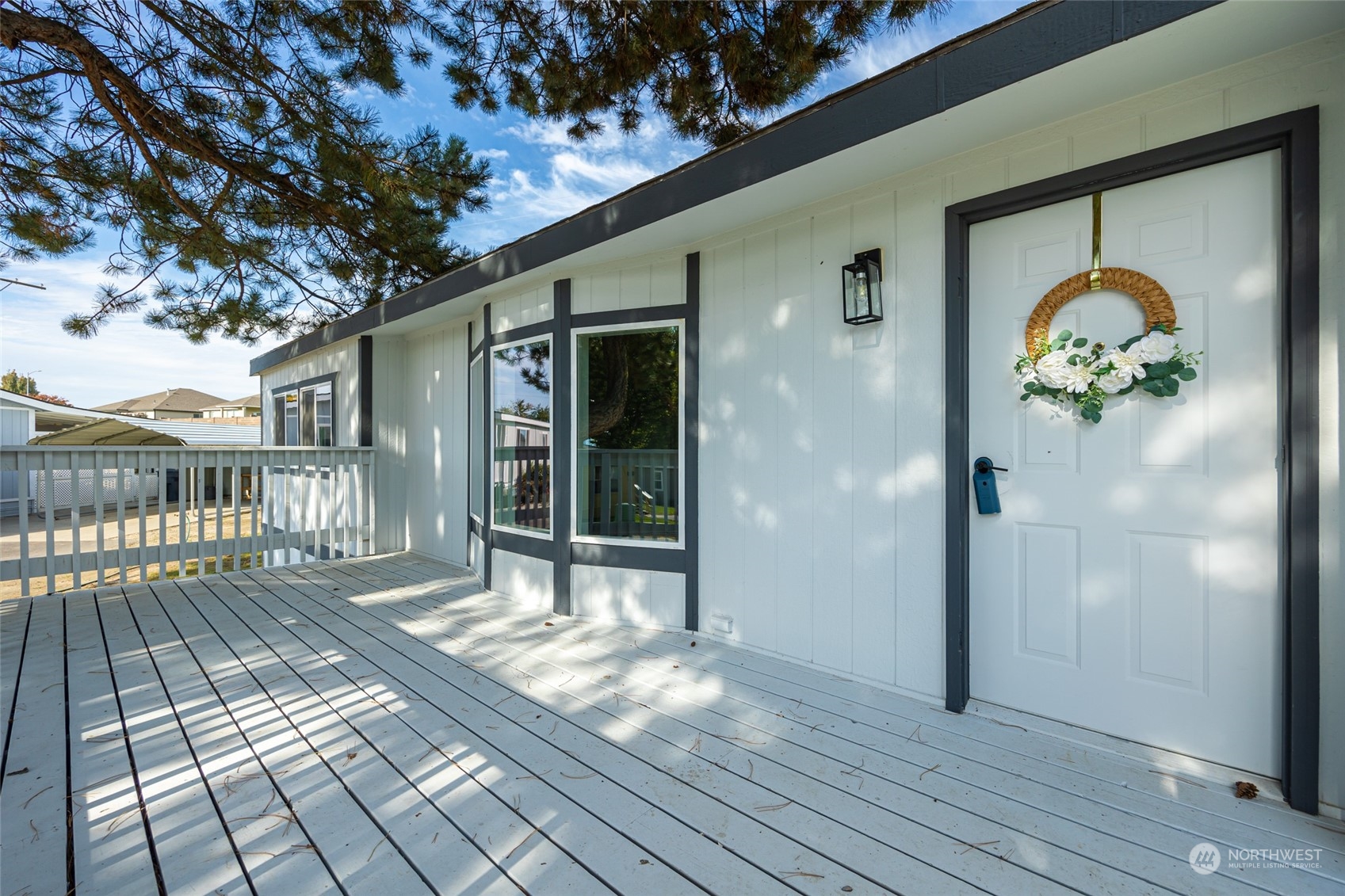 3517 N Road, Unit 115E Pasco, WA 99301 - Photo 1 of 26 a view of a porch with wooden floor and fence