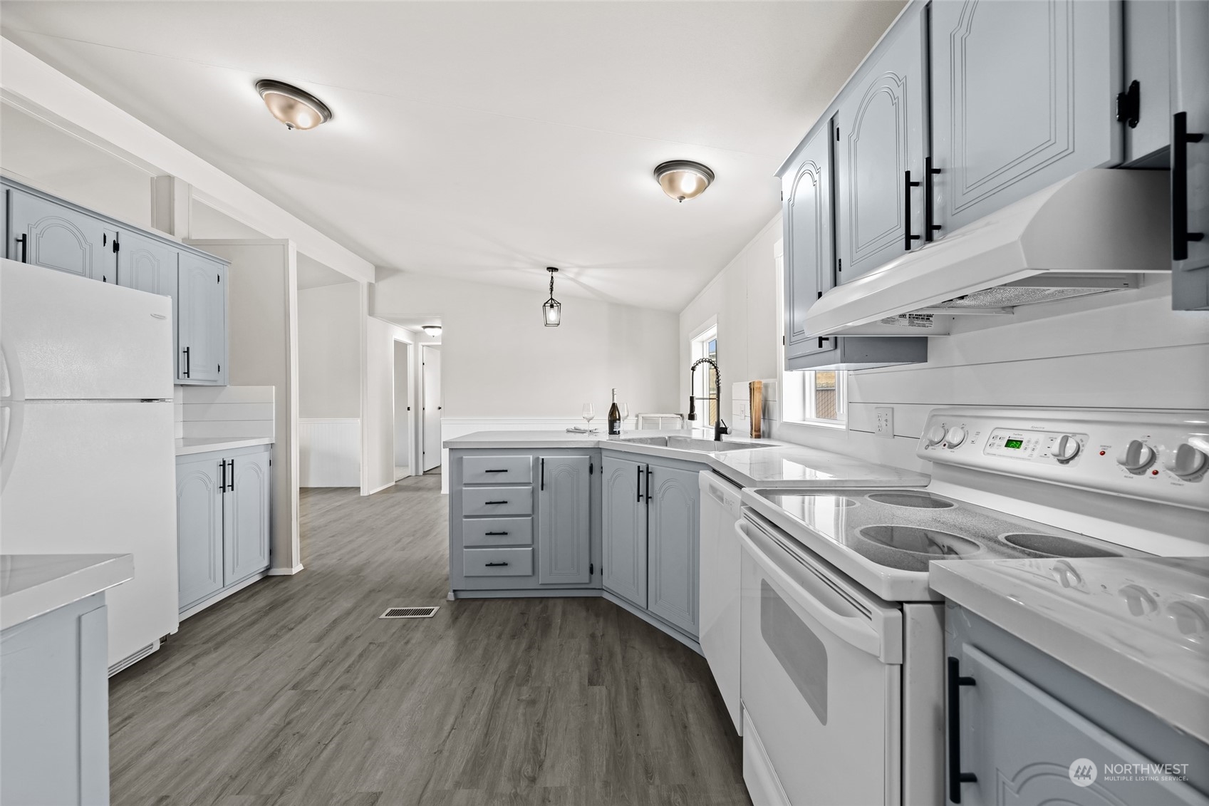3517 N Road, Unit 115E Pasco, WA 99301 - Photo 11 of 26 a kitchen with granite countertop a sink stainless steel appliances and cabinets