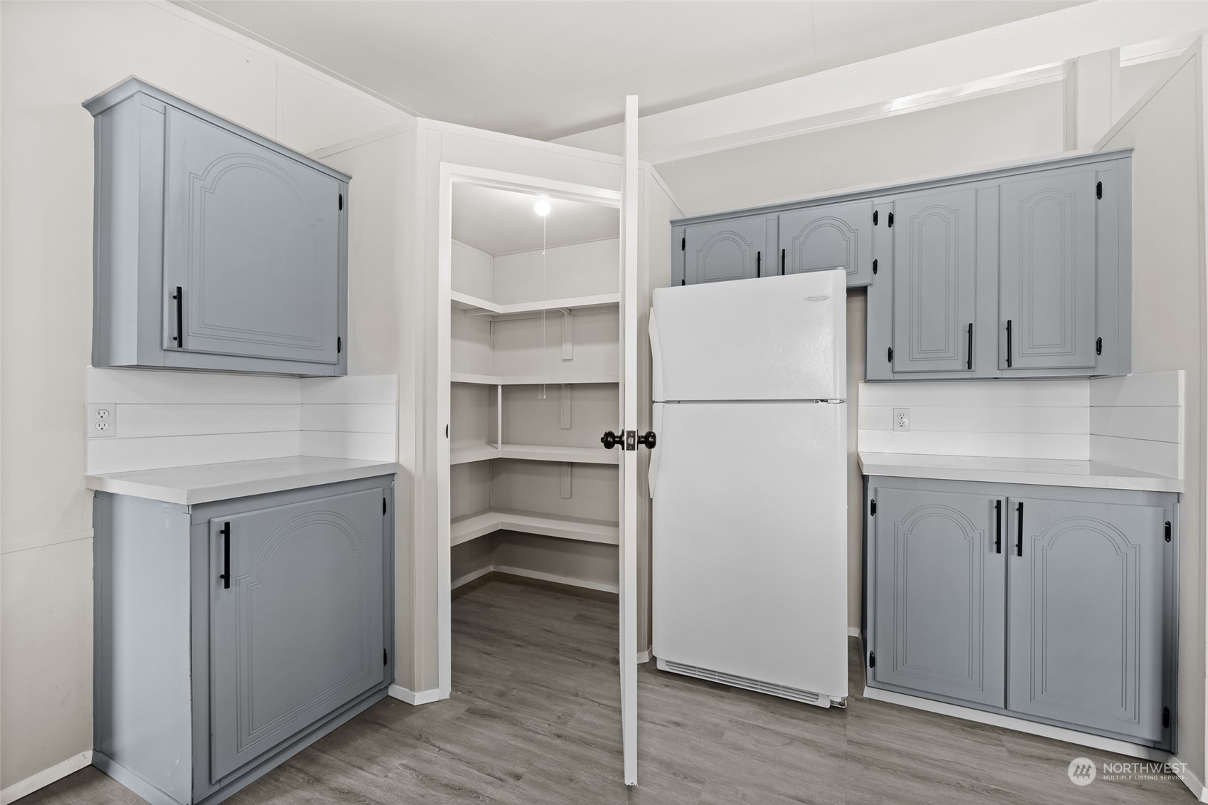 3517 N Road, Unit 115E Pasco, WA 99301 - Photo 12 of 26 a white refrigerator freezer sitting inside of a kitchen