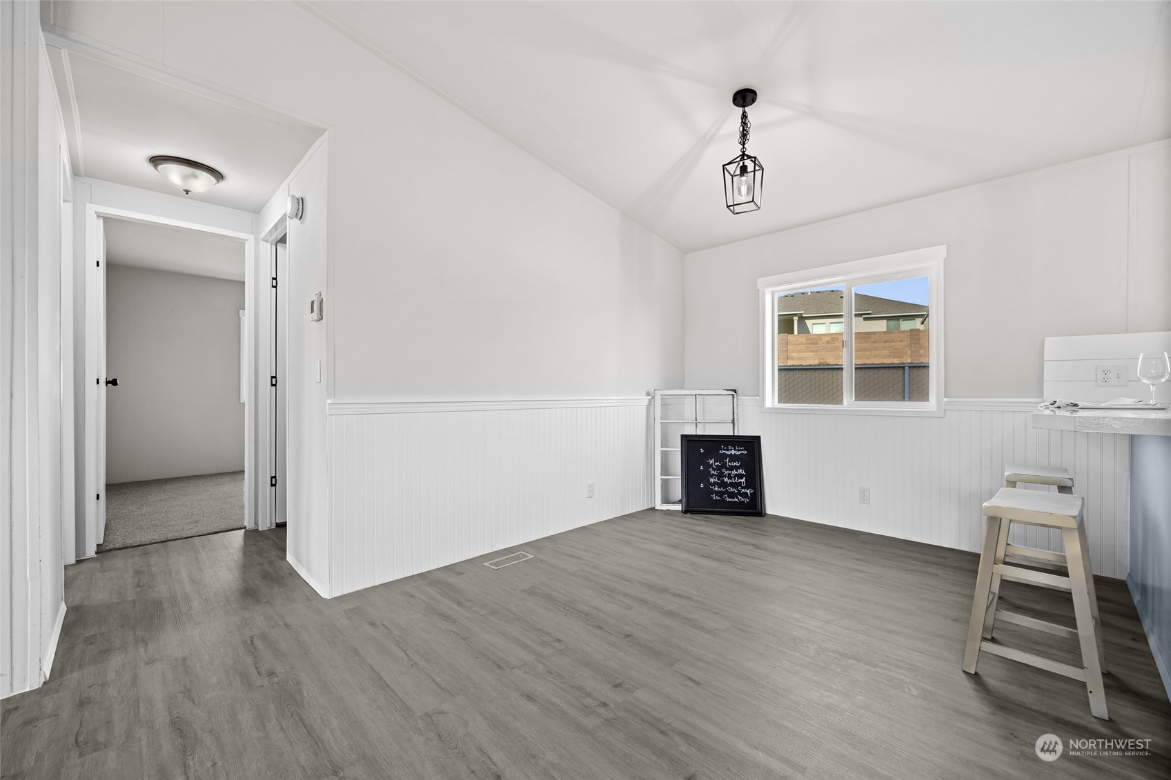 3517 N Road, Unit 115E Pasco, WA 99301 - Photo 13 of 26 an empty room with wooden floor fireplace and windows