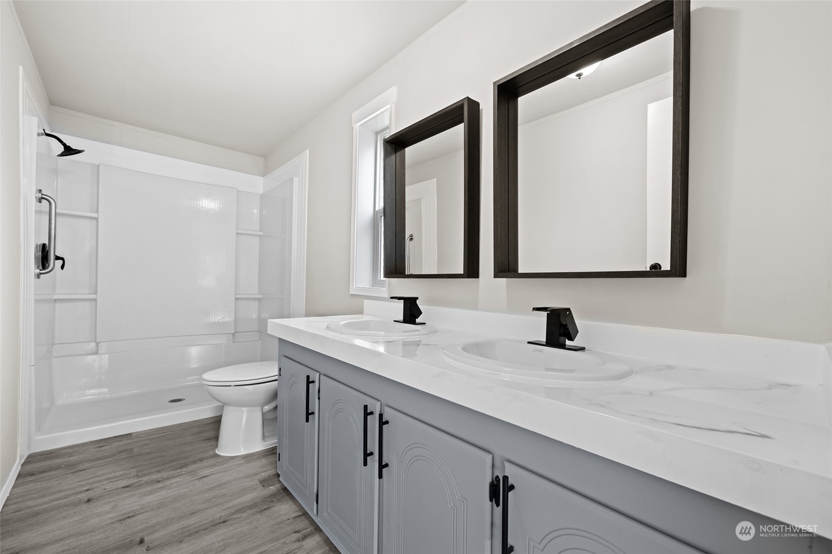 3517 N Road, Unit 115E Pasco, WA 99301 - Photo 17 of 26 a bathroom with a toilet a sink a vanity and mirror