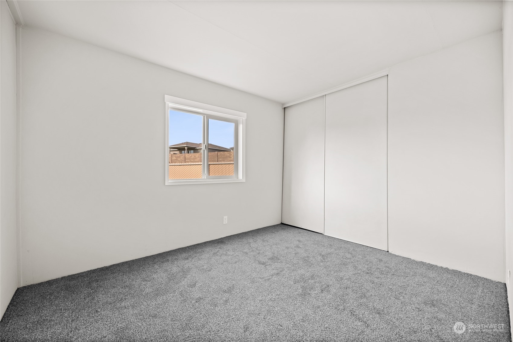 3517 N Road, Unit 115E Pasco, WA 99301 - Photo 18 of 26 a view of an empty room with a window
