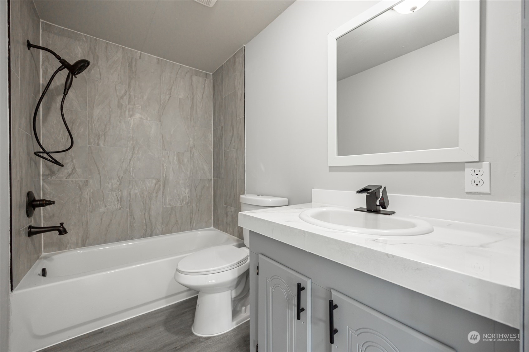 3517 N Road, Unit 115E Pasco, WA 99301 - Photo 21 of 26 a bathroom with a granite countertop toilet sink and a bathtub