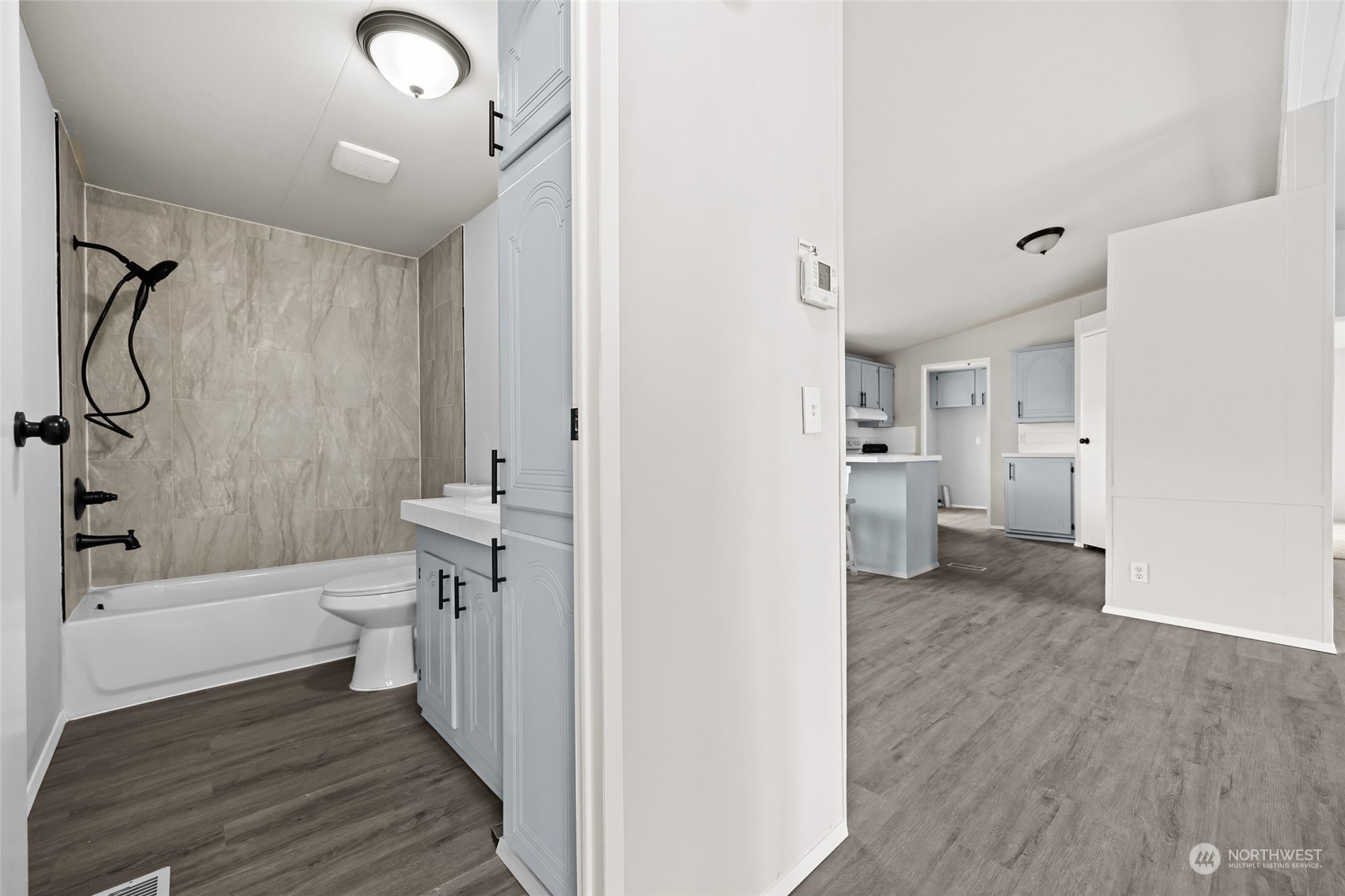 3517 N Road, Unit 115E Pasco, WA 99301 - Photo 22 of 26 a bathroom with a sink a toilet and a shower