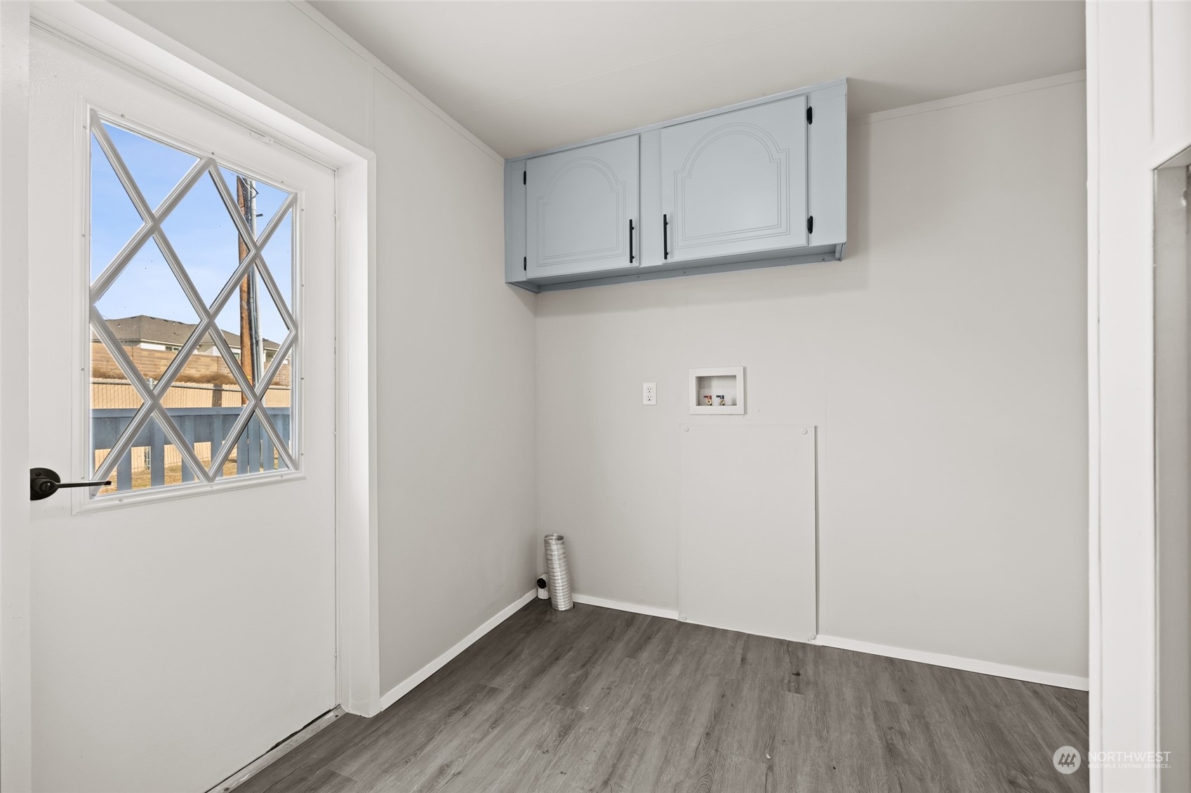 3517 N Road, Unit 115E Pasco, WA 99301 - Photo 23 of 26 a view of an empty room with a window and wooden floor