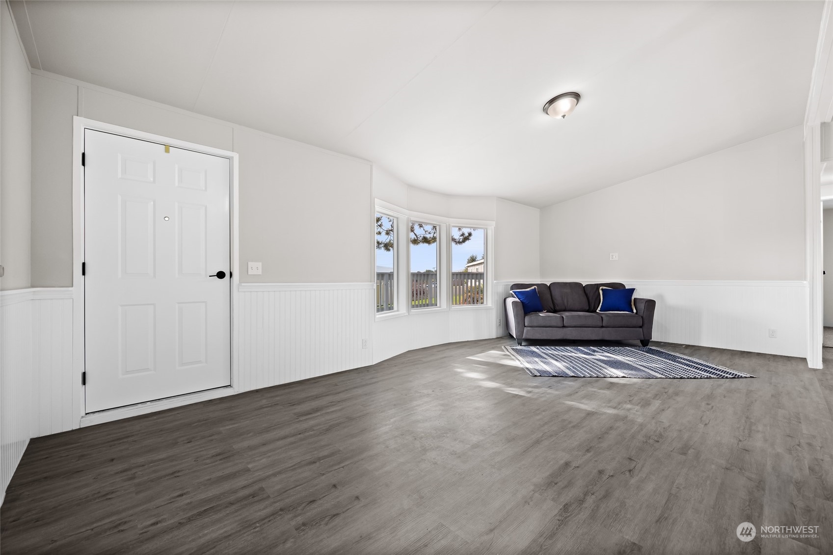 3517 N Road, Unit 115E Pasco, WA 99301 - Photo 5 of 26 a living room with furniture and a wooden floor