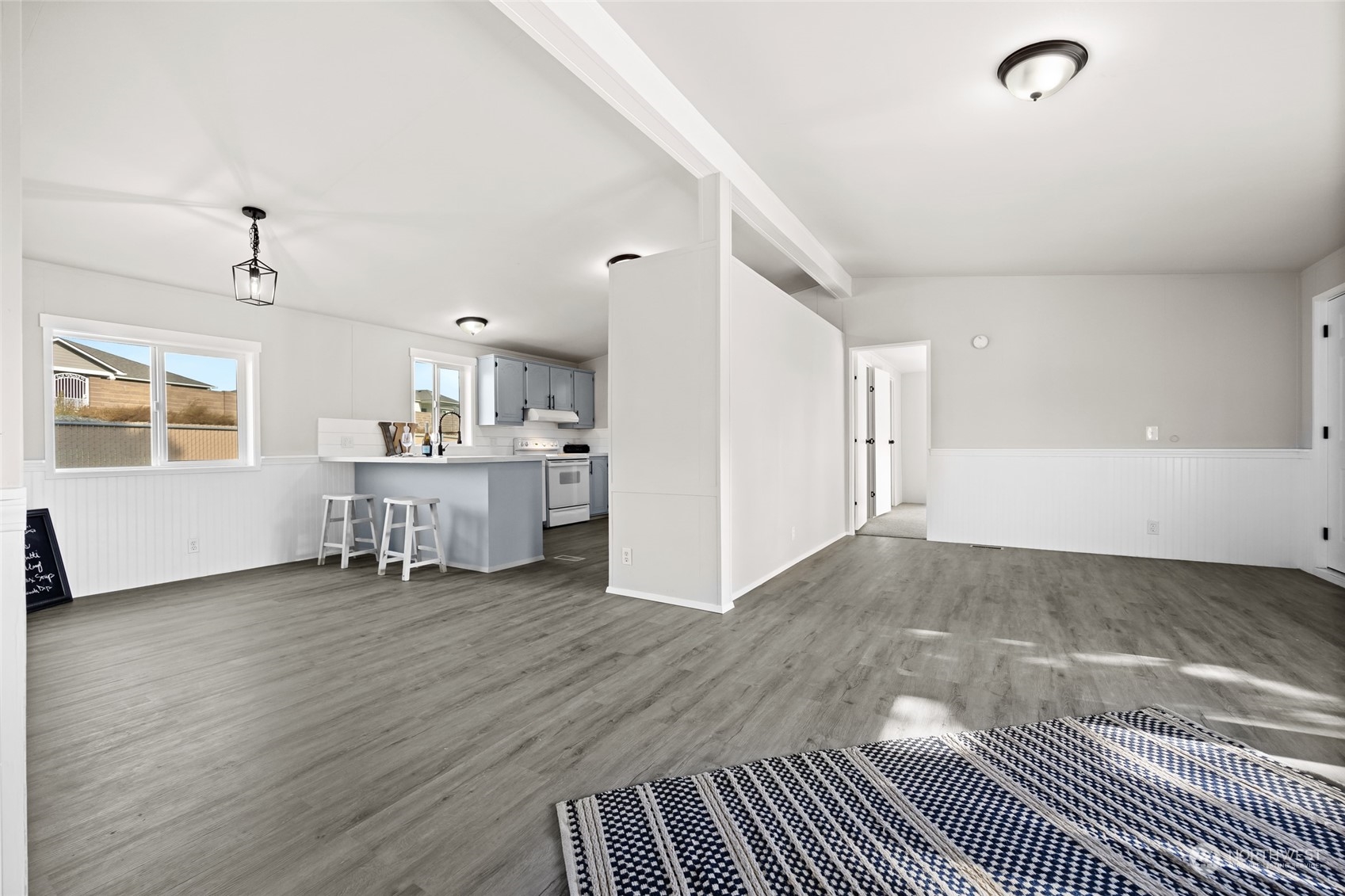 3517 N Road, Unit 115E Pasco, WA 99301 - Photo 7 of 26 a view of a livingroom with wooden floor and furniture