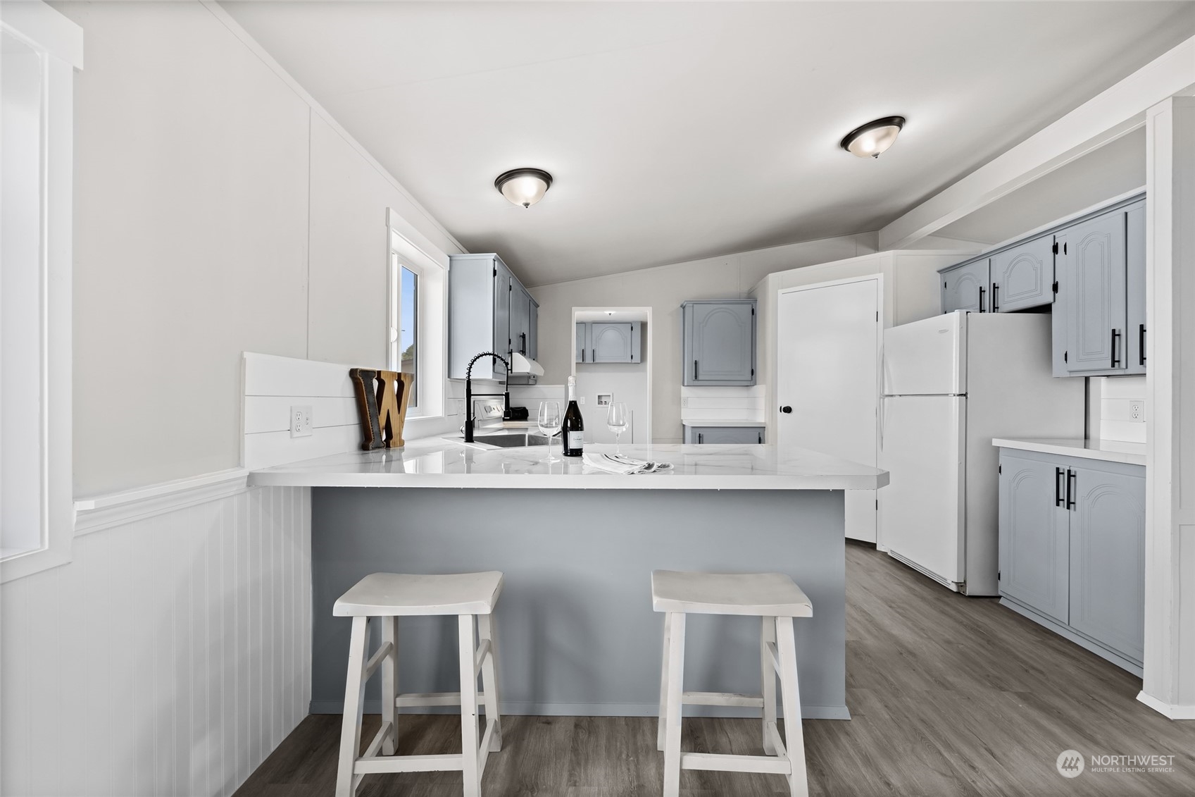 3517 N Road, Unit 115E Pasco, WA 99301 - Photo 9 of 26 a kitchen with stainless steel appliances a sink and cabinets