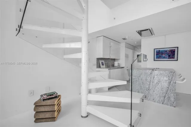 a bedroom with a bed and a ceiling fan