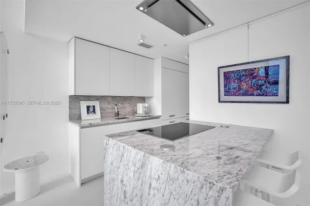 a view of a kitchen and a sink