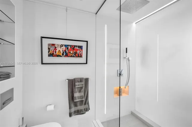 a bathroom with a shower and a shower