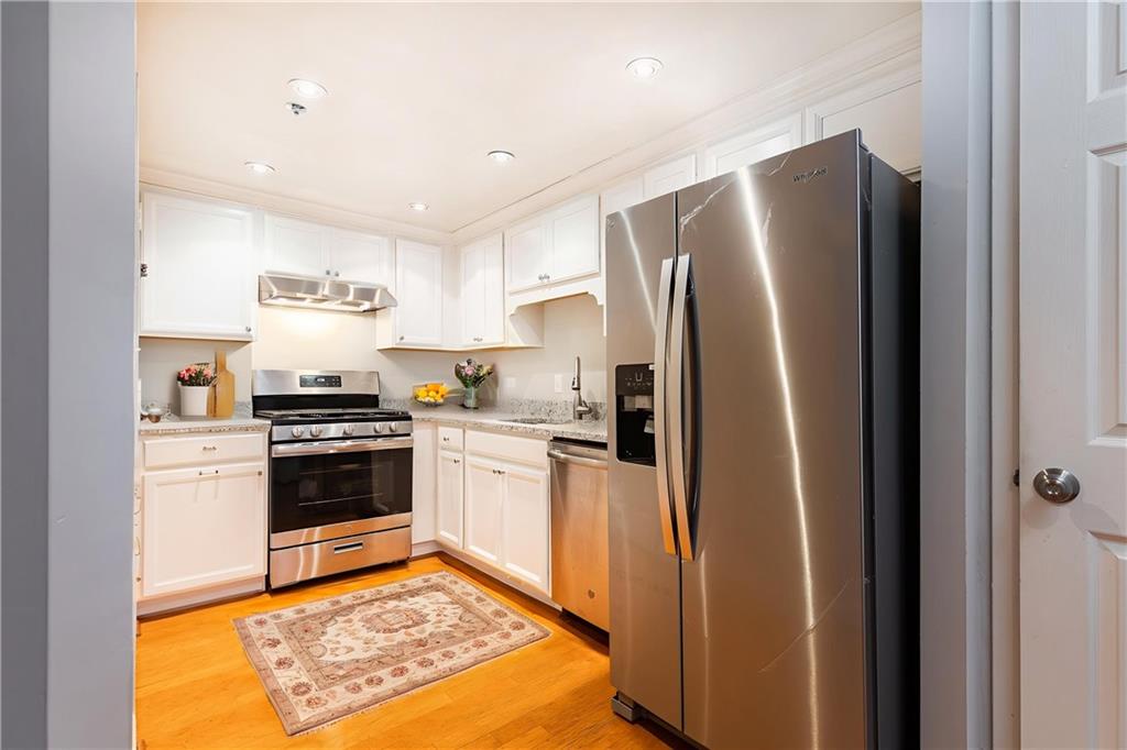 1501 Clairmont Road, Unit 1525 Decatur, GA 30033 - Photo 2 of 26 a kitchen with stainless steel appliances granite countertop a refrigerator stove and sink