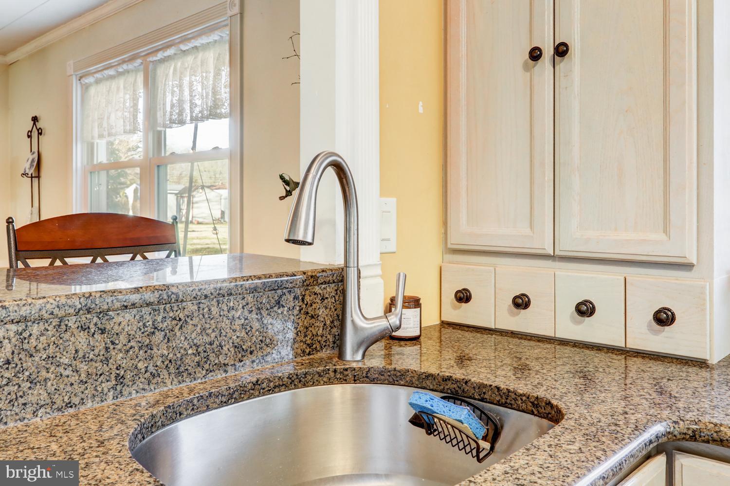 341 Maxson Road Lancaster, PA 17601 - Photo 11 of 32 a kitchen with granite countertop a sink and a window