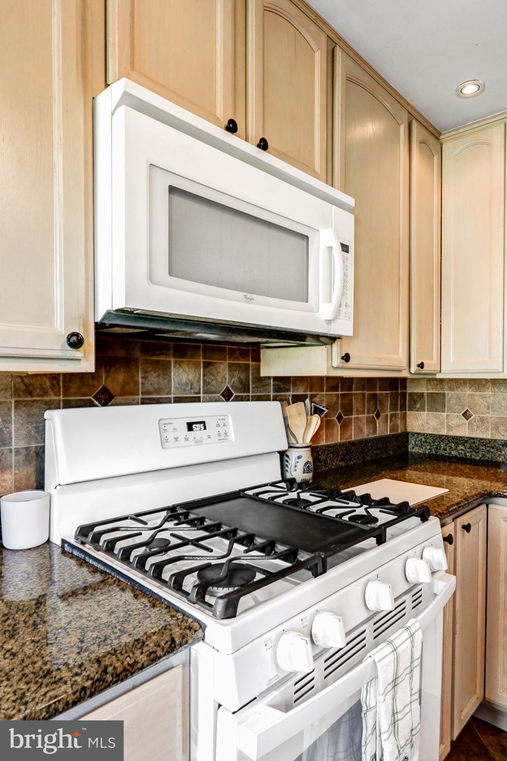 341 Maxson Road Lancaster, PA 17601 - Photo 12 of 32 a stove top oven sitting inside of a kitchen