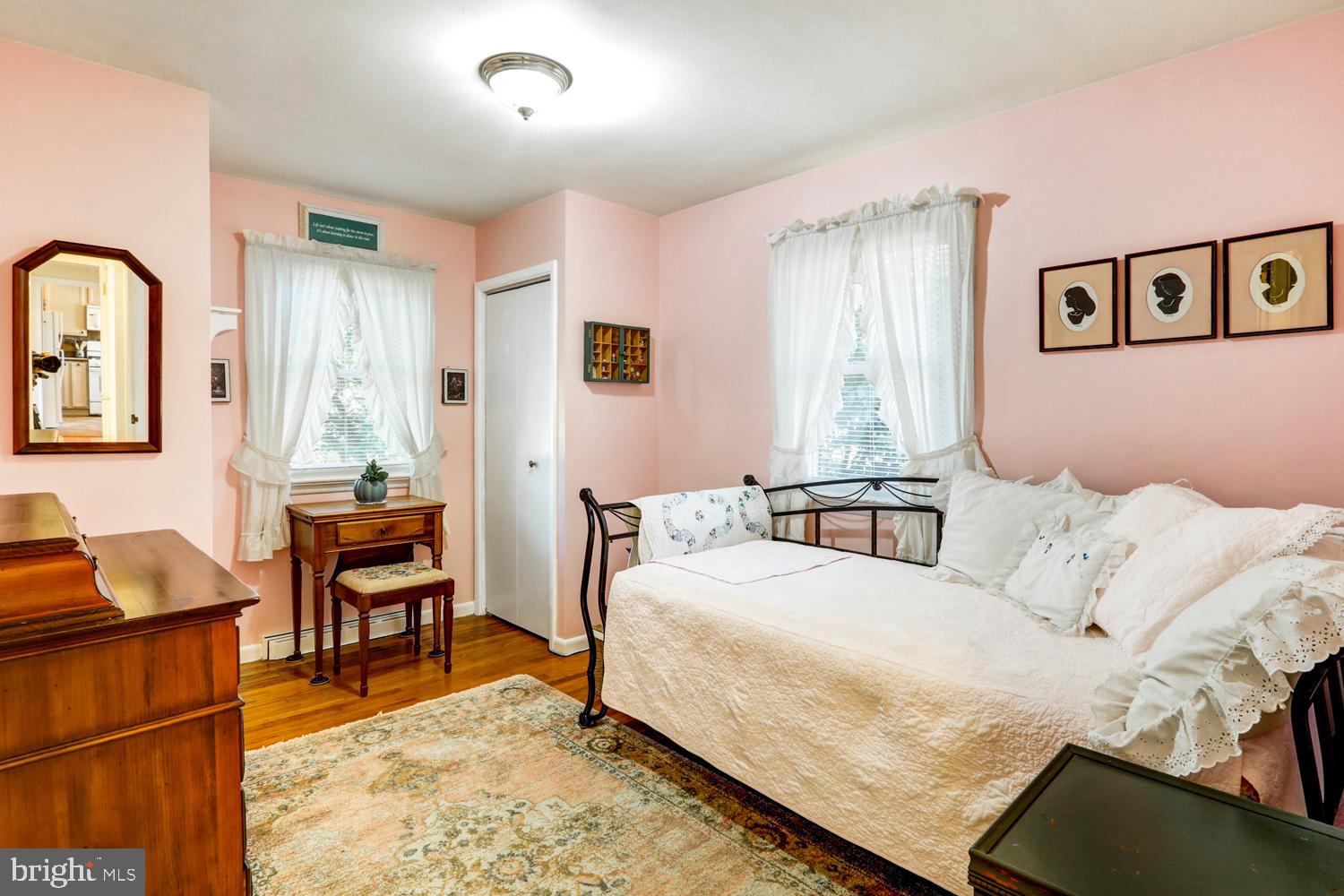 341 Maxson Road Lancaster, PA 17601 - Photo 14 of 32 a bedroom with a bed and wooden floor