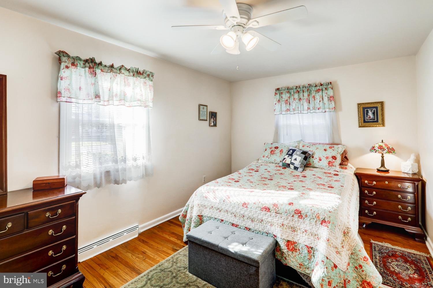 341 Maxson Road Lancaster, PA 17601 - Photo 18 of 32 a bedroom with a bed and wooden floor