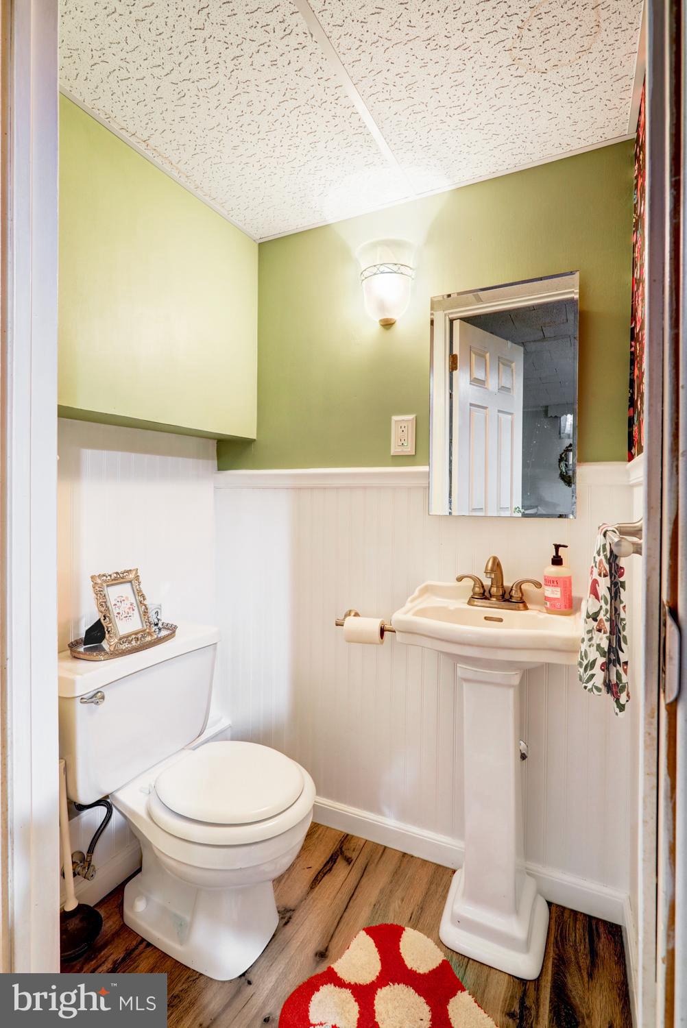 341 Maxson Road Lancaster, PA 17601 - Photo 22 of 32 a bathroom with a toilet a sink and mirror