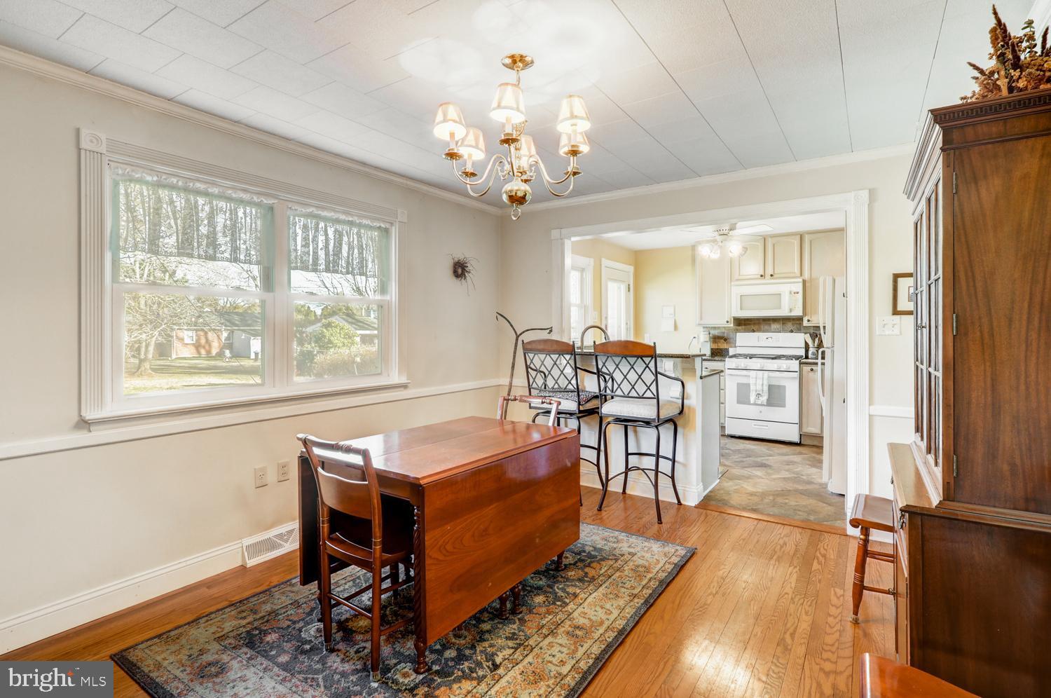 341 Maxson Road Lancaster, PA 17601 - Photo 5 of 32 a living room with furniture and a chandelier