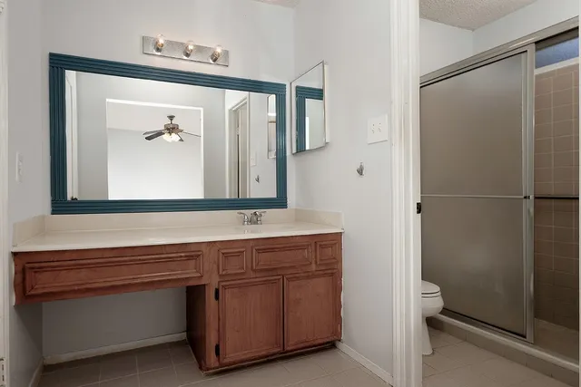a bathroom with a vanity a sink and a mirror