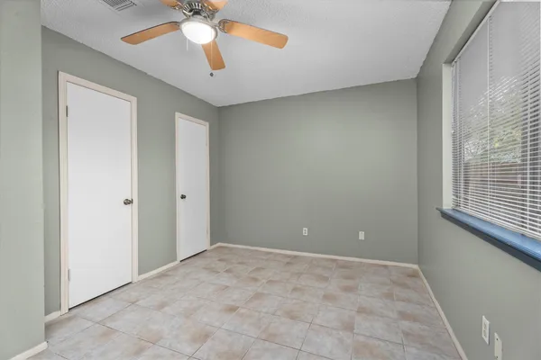 a view of an empty room with a window