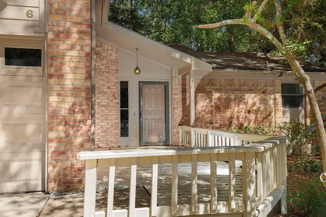 a view of a brick house with a large window