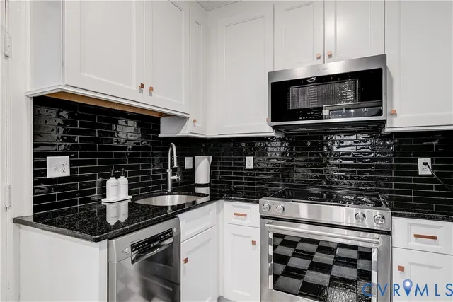 a bedroom with furniture and a large window