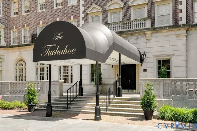 a living room with furniture potted plant and a window