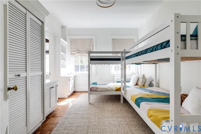 a bed room with a bed and a dresser