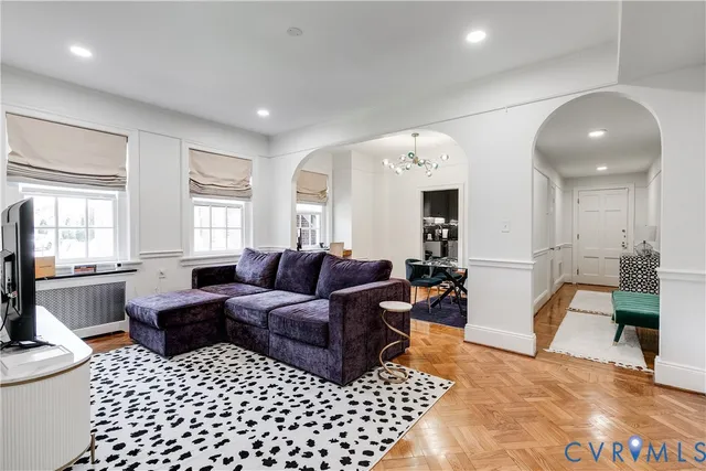 a view of a livingroom with furniture and wooden floor