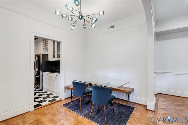 a kitchen with stainless steel appliances a stove a sink and a refrigerator