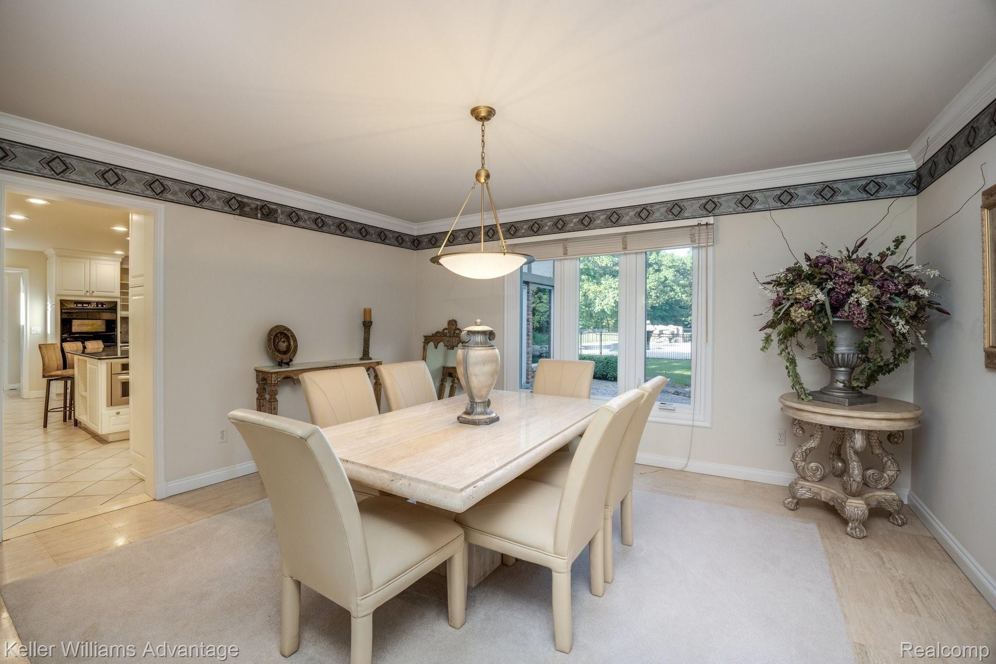 38125 Hayes Road Sterling Heights, MI 48313 - Photo 11 of 83 Dining room w crown trim and stone floors