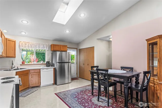 a view of a dining room with furniture and window