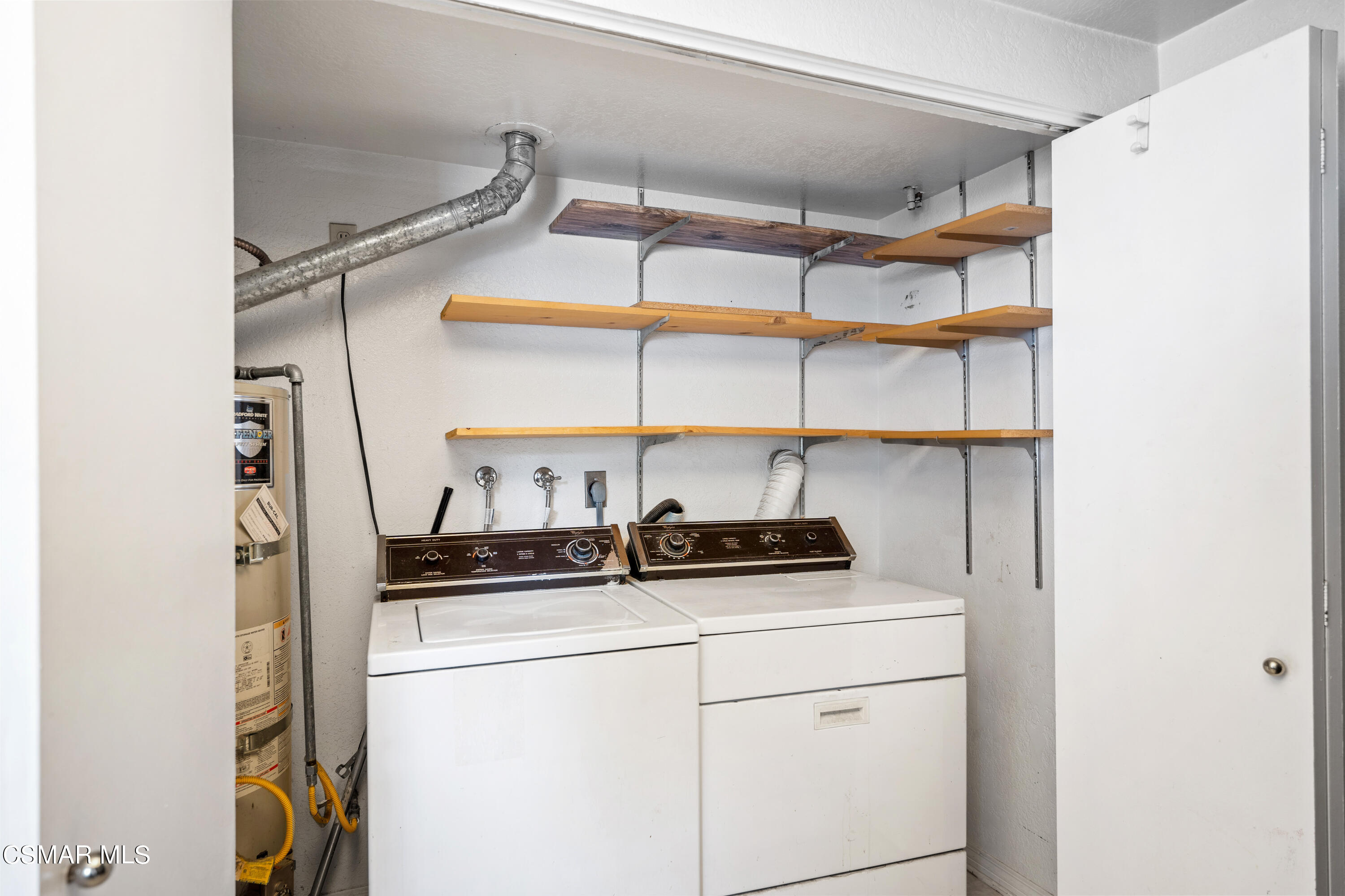 1866 Rory Lane, Unit 6 Simi Valley, CA 93063 - Photo 21 of 25 a kitchen with stainless steel appliances a sink and cabinets