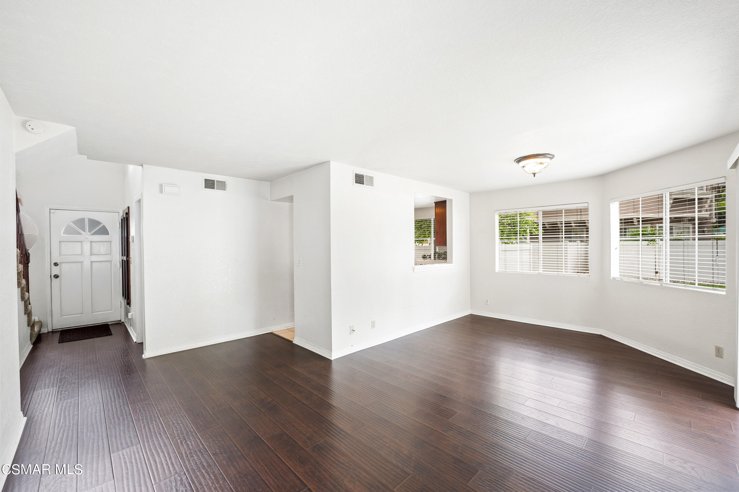 1866 Rory Lane, Unit 6 Simi Valley, CA 93063 - Photo 5 of 25 a view of an empty room with a window and wooden floor